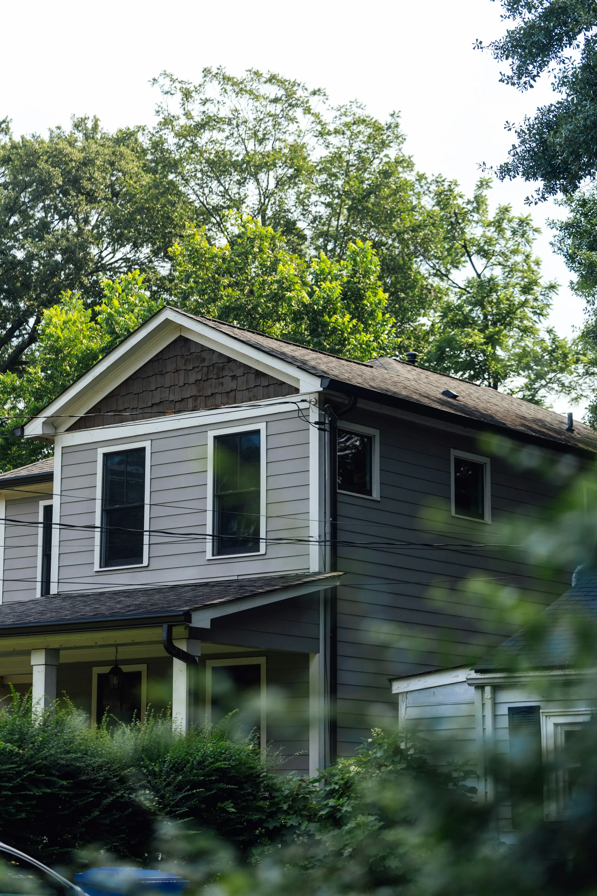 Small detached backyard cottage with its own porch and entry door